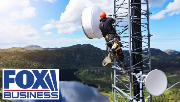 FCC Chair Climbs Tower, Highlighting Connectivity Push