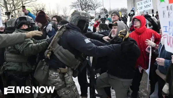 ICE Agent Charged in Minnesota Crackdown After Gun Threat