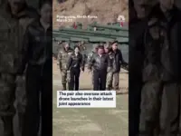 Kim Jong Un Poses with Daughter on Tank