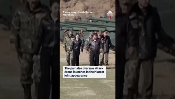 Kim Jong Un Poses with Daughter on Tank