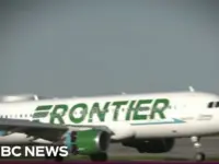 LAX Plane Narrowly Avoids Collision With Trucks